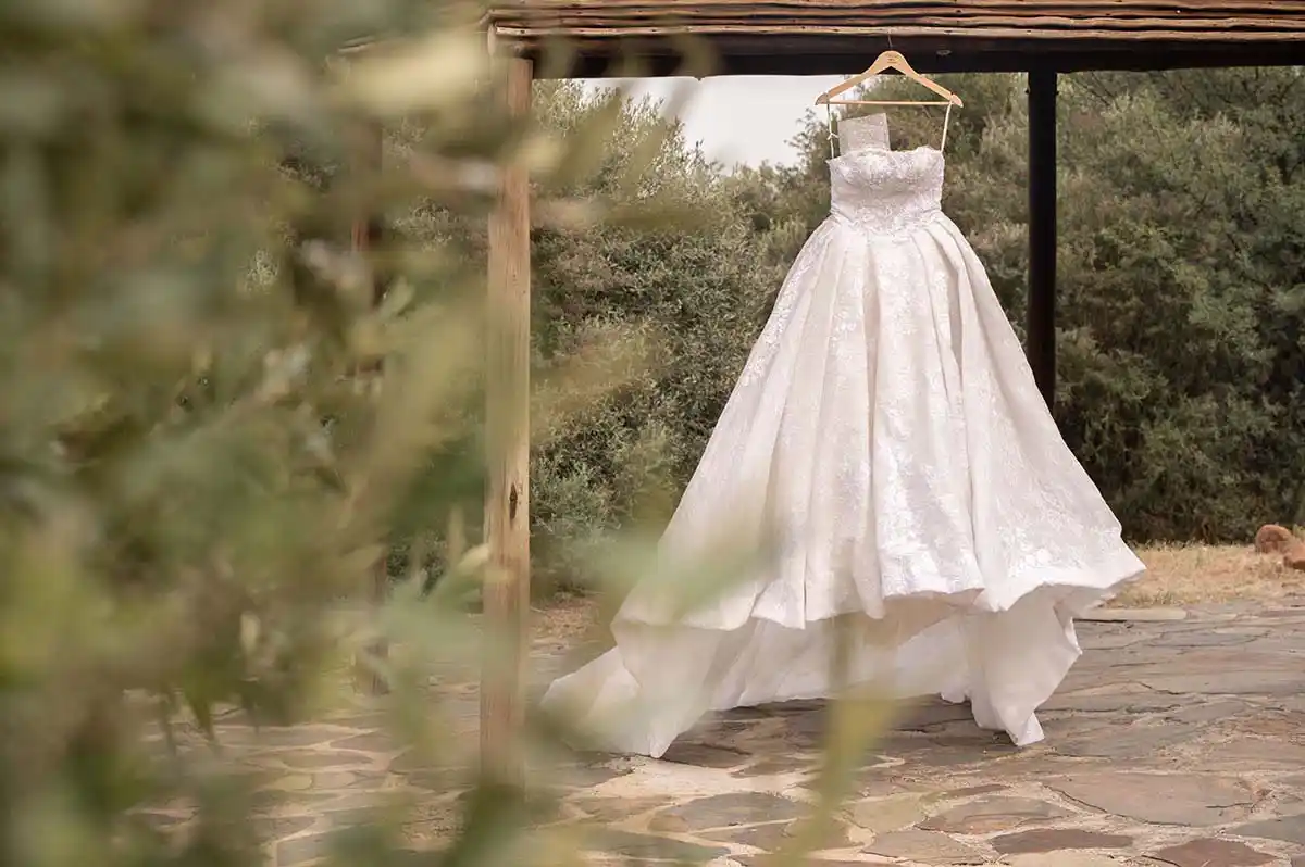 Wedding dress hanging in nature Bloemfontein Amanzi wedding photography