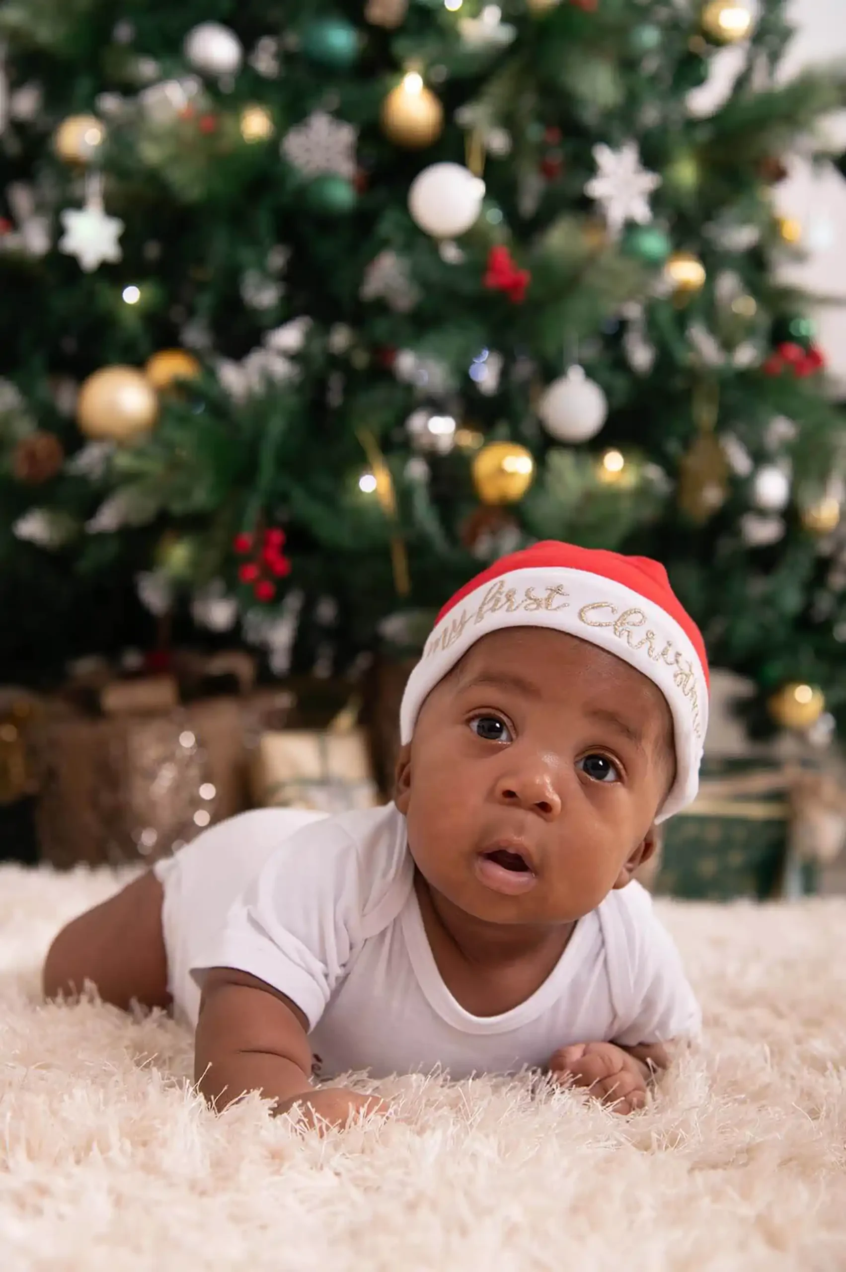 baby at Christmas mini shoot in Bloemfontein mudboots photography first Christmas